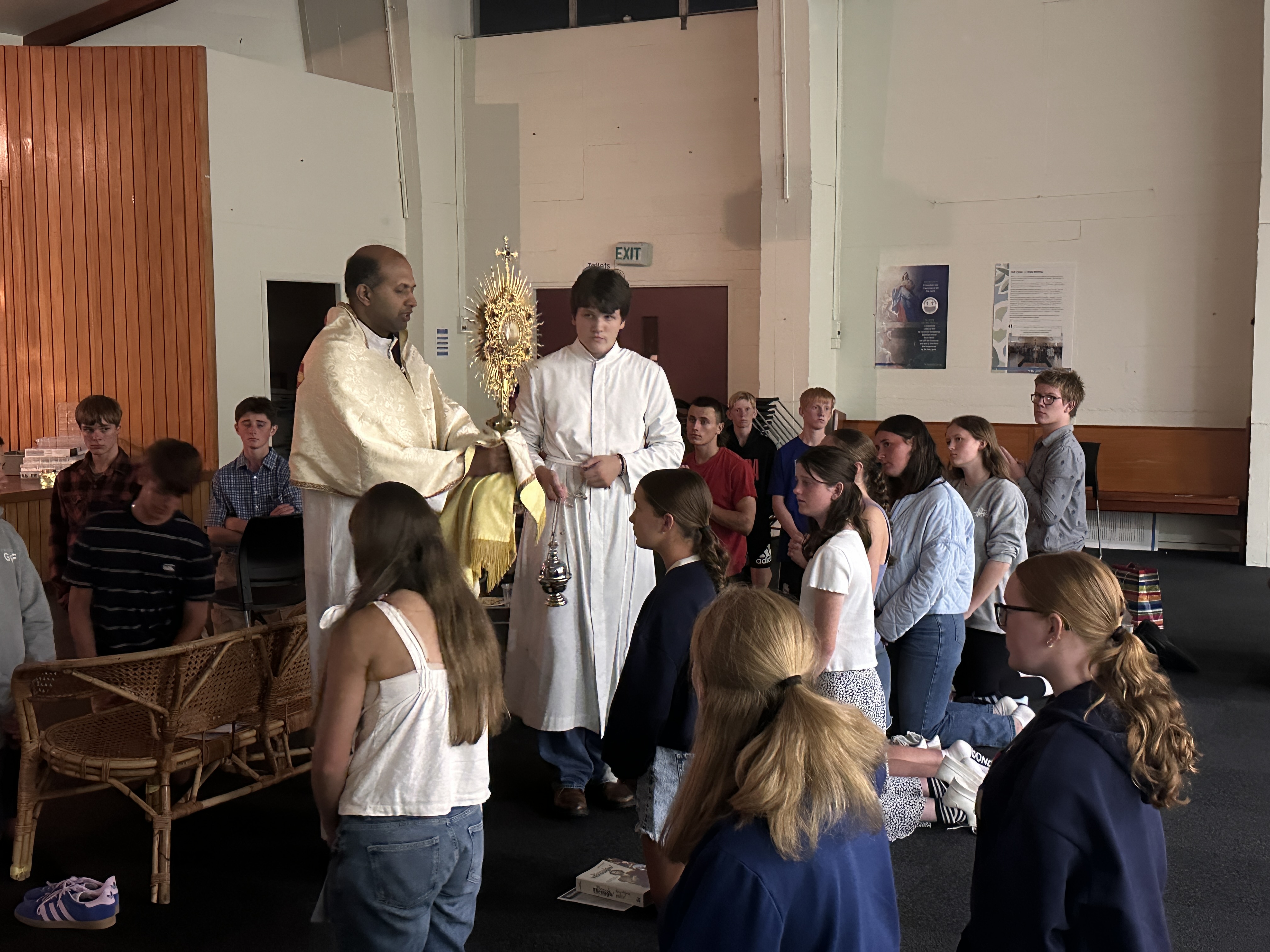 Parish youth gathered in prayer during Eucharistic Adoration